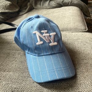 NY hat detailed with blue and white stripes